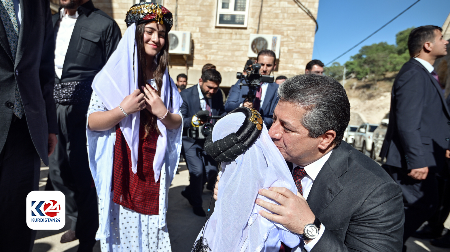 Kurdistan Region Prime Minister Masrour Barzani embracing a Yezidi child. (Photo: Kurdistan24)