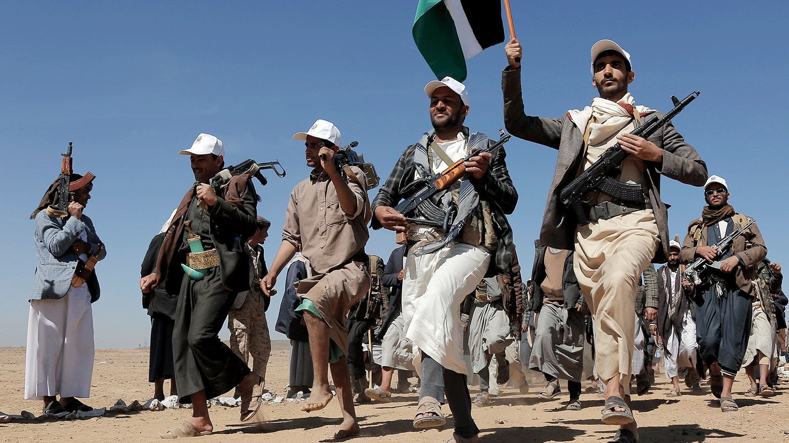 Houthi rebel fighters march during a rally of support for the Palestinians in the Gaza Strip and against the U.S. strikes on Yemen outside Sanaa on Jan. 22, 2024. (Photo: AP)