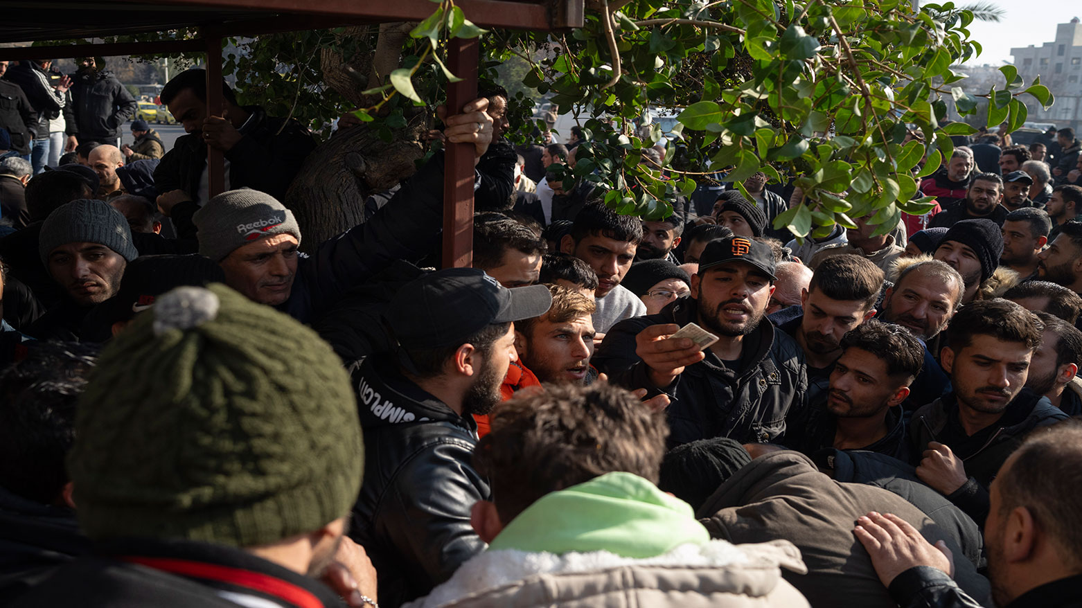 Members of Bashar Assad's army, or a pro-government militia, gather to be registered with Syrian rebels as part of an "identification and reconciliation process" in Damascus, Syria, Dec. 21, 2024. (Photo: AP)
