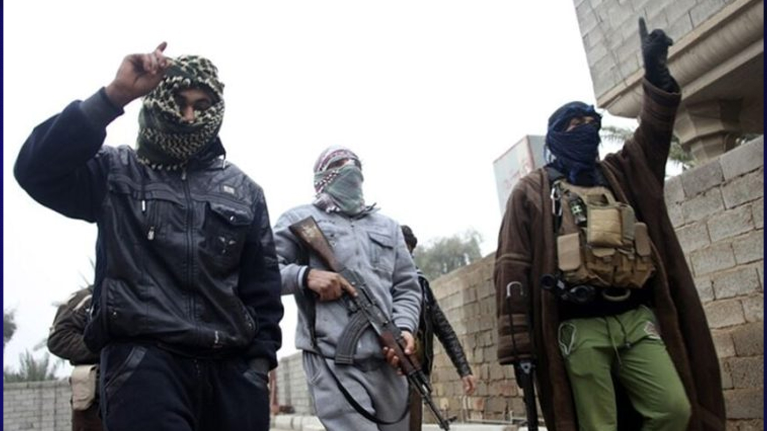 unidentified masked gunmen. (Photo: SOHR)