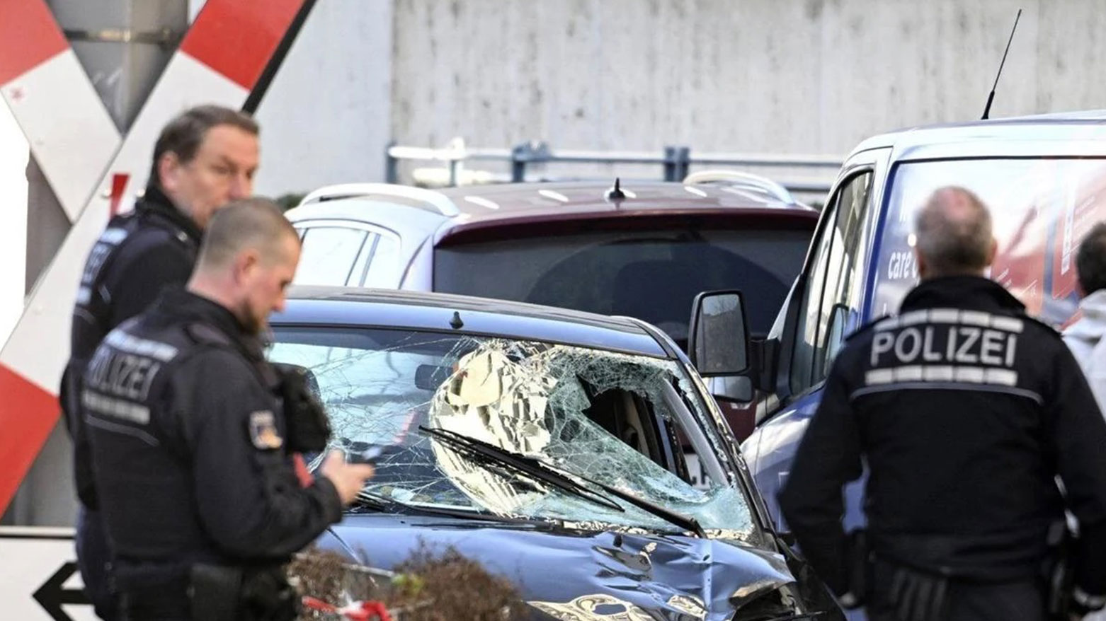 Police officers stand next to a damaged vehicle in the city center of Mannheim, Germany, March 3, 2025. (Photo: AP)