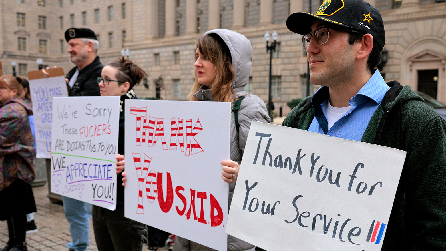 WASHINGTON, DC - FEBRUARY 27: Supporters hold signs as former United States Agency for International Development (USAID) employees terminated. (Photo: AFP)