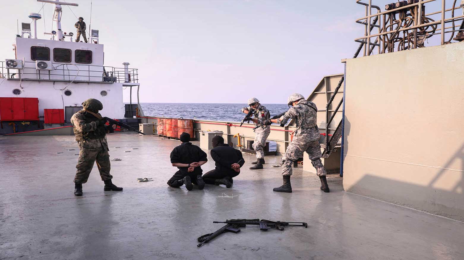 This photo provided, Jan. 21, 2022, by the Iranian Army, navy members train a scenario of release of a ship held hostage in a joint naval drill of Iran, Russia and China in the Indian Ocean. (Photo: Iranian Army via AP)