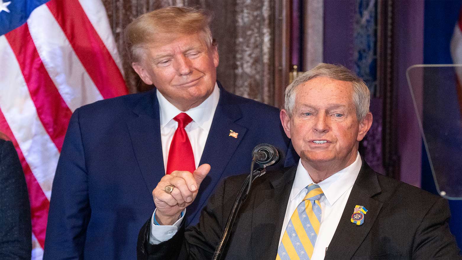 President Donald Trump, (L) listens as Rep. Joe Wilson, R-S.C., speaks at a campaign event at the South Carolina Statehouse, Jan. 28, 2023, in Columbia, S.C. (Photo: AP)