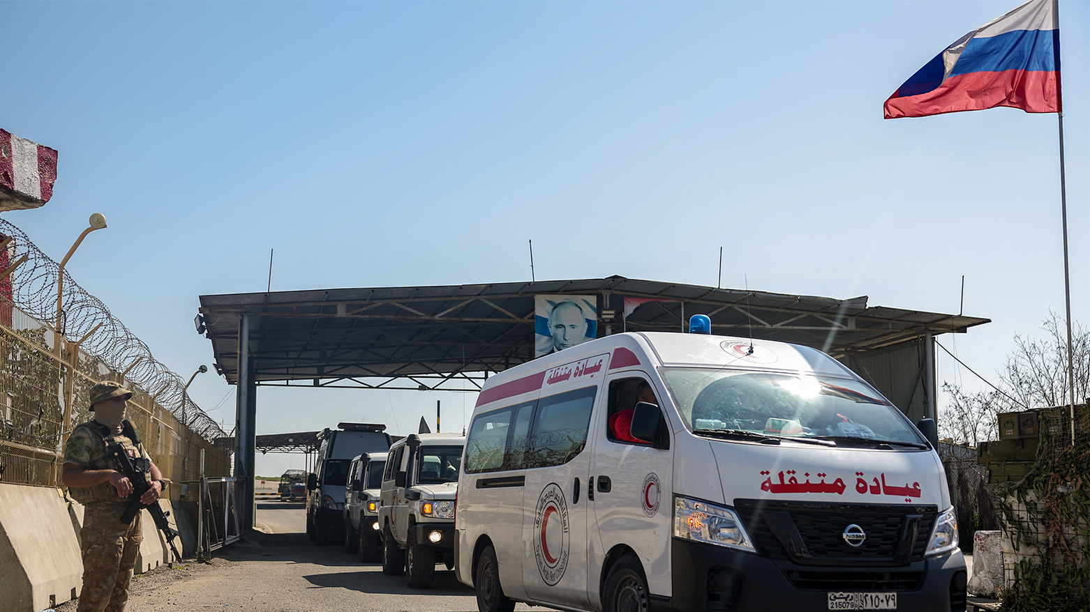 Syrian Red Crescent members evacuate wounded civilians who took refuge from violence in the Hmeimim Russian base in Syria's Latakia Mediterranean province, on Mar. 11, 2025.(Photo: AFP)