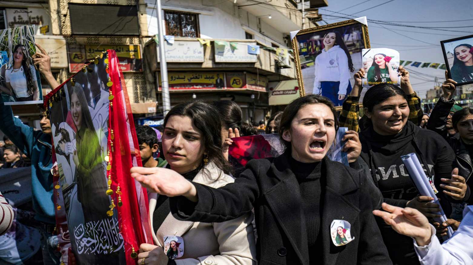 A woman reacts as people gather for a mass demonstration in Syria's northeastern city of Qamishli on March 11, 2025 protesting against a recent wave of sectarian violence targeting Syria's Alawite minority. (Photo: AFP)