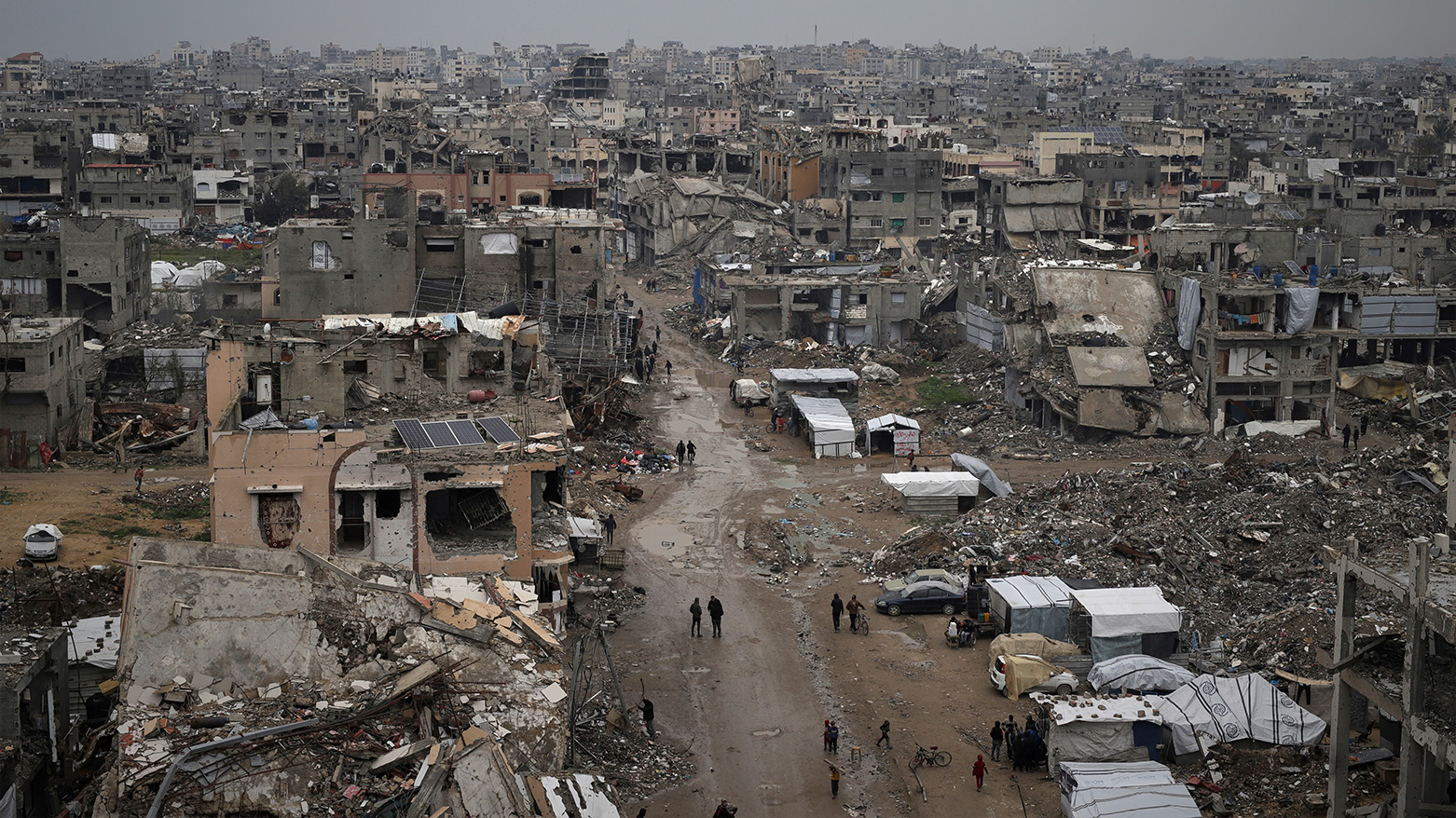 Palestinians walk surrounded by the rubble of destroyed homes and building in the Zeitoun neighborhood of Gaza City, Friday, March 7, 2025. (Photo: AP)