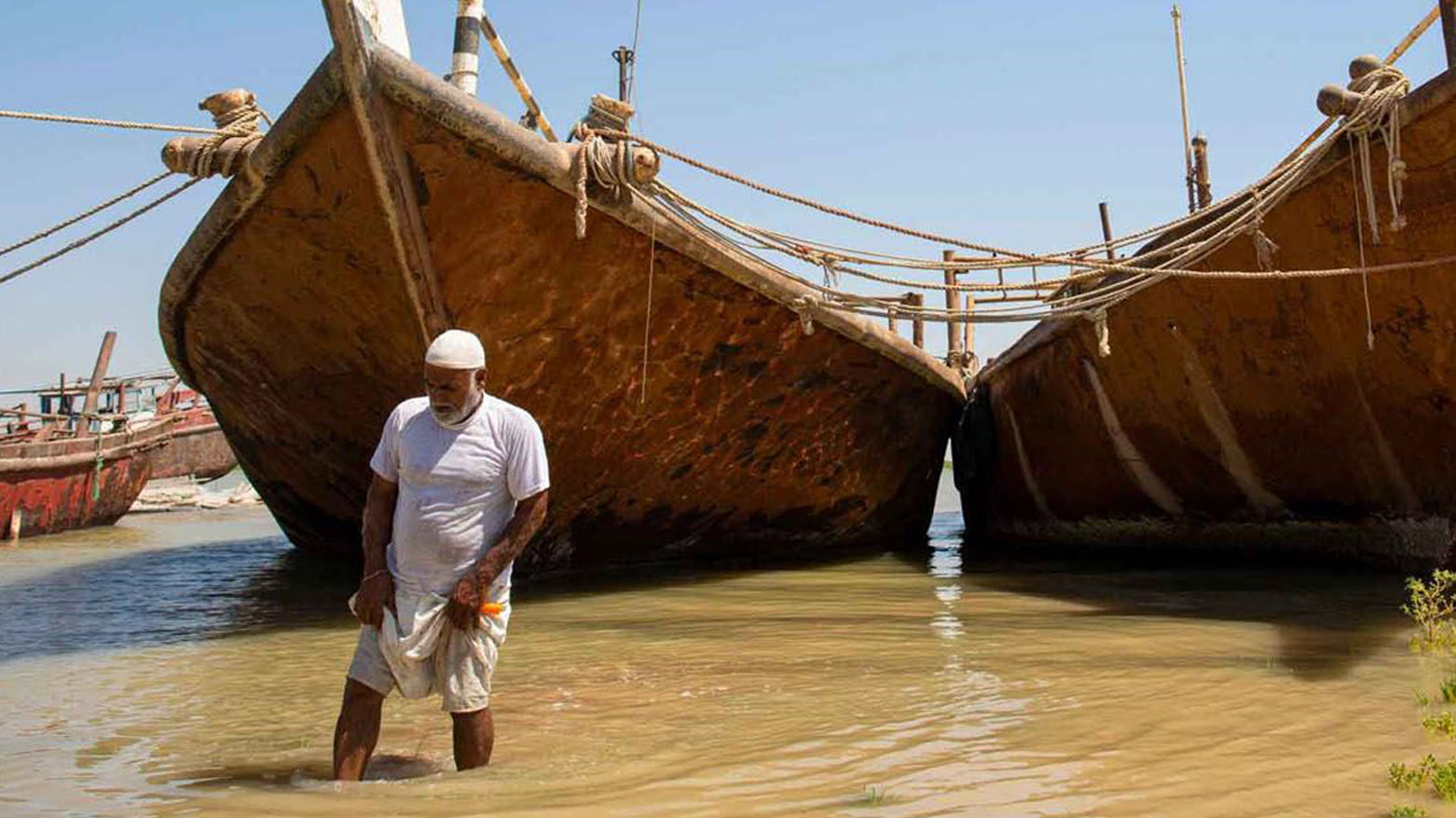 An Iraqi farmer inspects the water level near his land in Iraq's southern port city of al-Faw, 90 kilometres south of Basra near the Shatt al-Arab and the Gulf on August 17, 2020. (Photo: AFP)