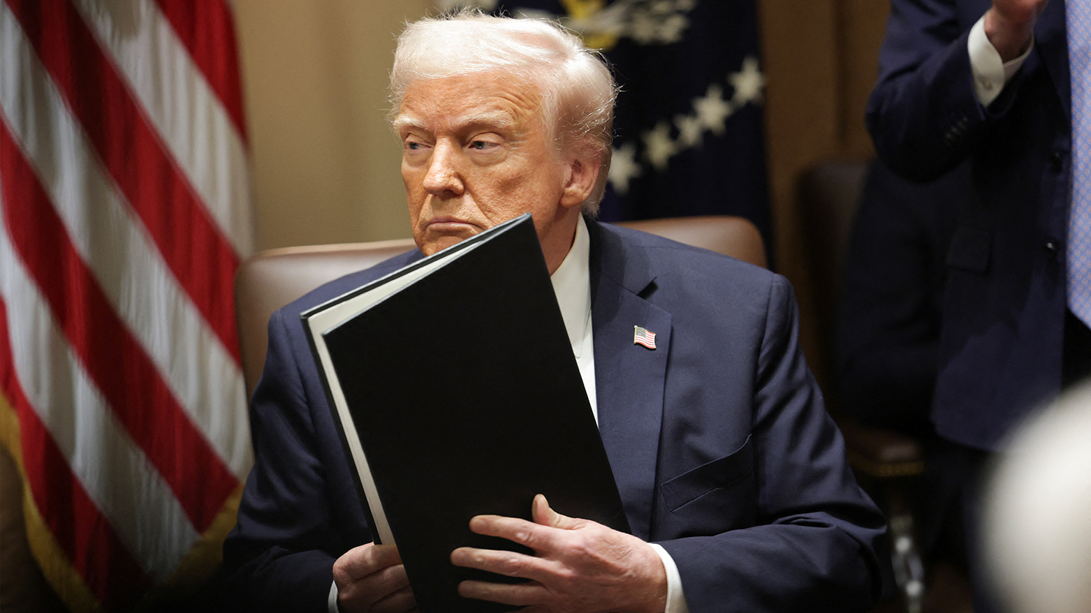 U.S. President Donald Trump holds paperwork he signed during an Ambassador Meeting in the Cabinet Room of the White House on Mar. 25, 2025 in Washington, DC.(Photo: AFP)