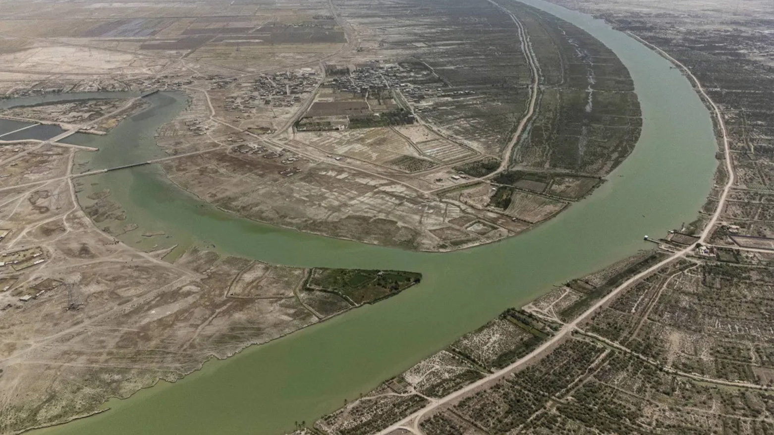 An aerial picture shows agricultural land surrounding effluents of the Shatt al-Arab waterway, where the Tigris and Euphrates rivers meet, in Iraq's southern city of Basra, on June 12, 2023. (Photo: AFP)