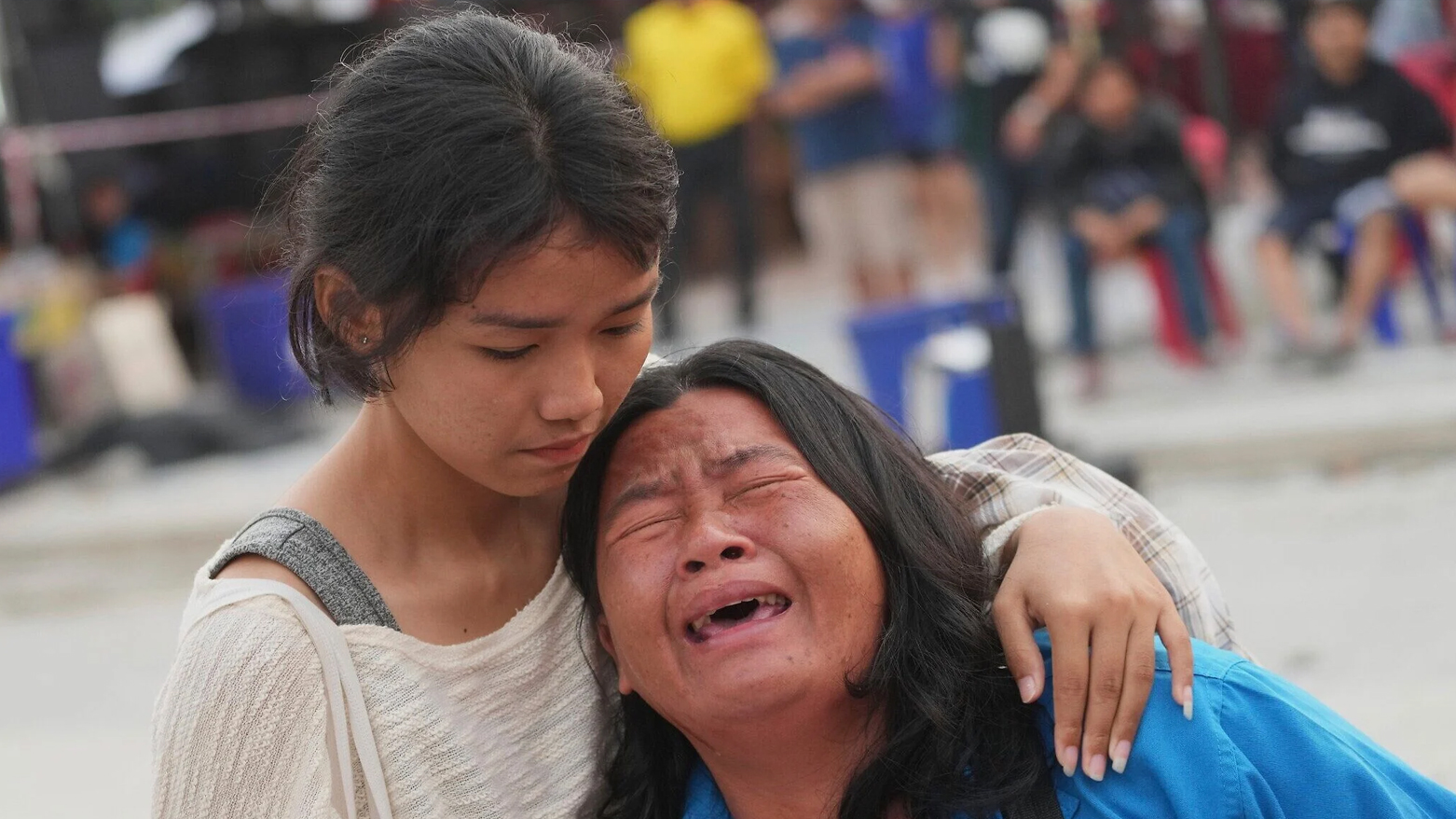 A woman reacts after being informed that her husband had died at the site of a collapsed under construction high-rise building in Bangkok, Thailand, Sunday, Mar. 30, 2025. (Photo: AP )