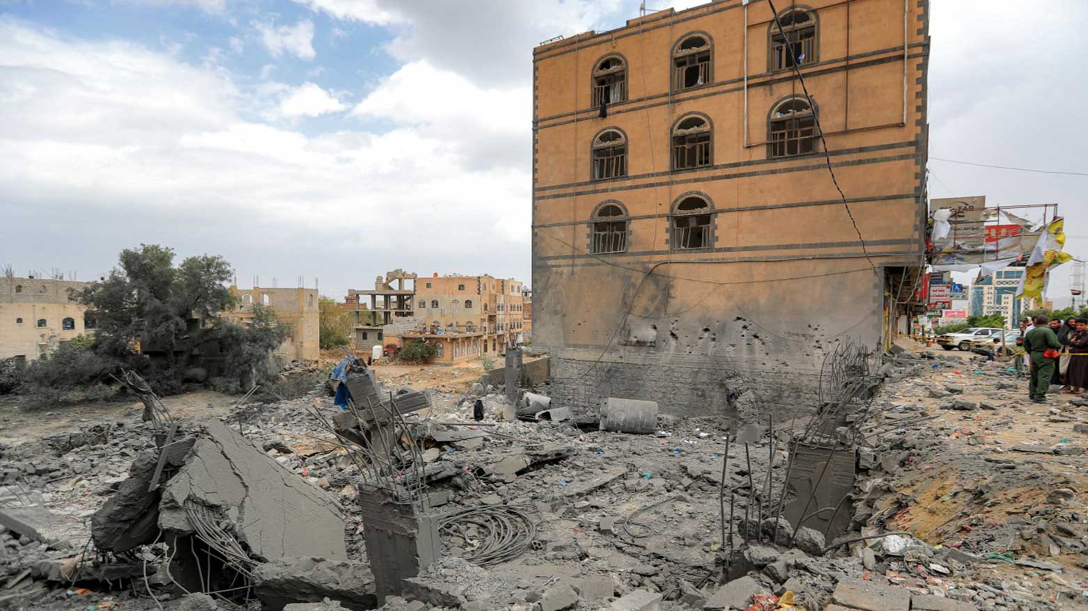 People gather by the rubble of a collapsed building at the site of a reported US air strike on Yemen's Huthi-held capital Sanaa on March 24, 2025. (Photo: AFP)