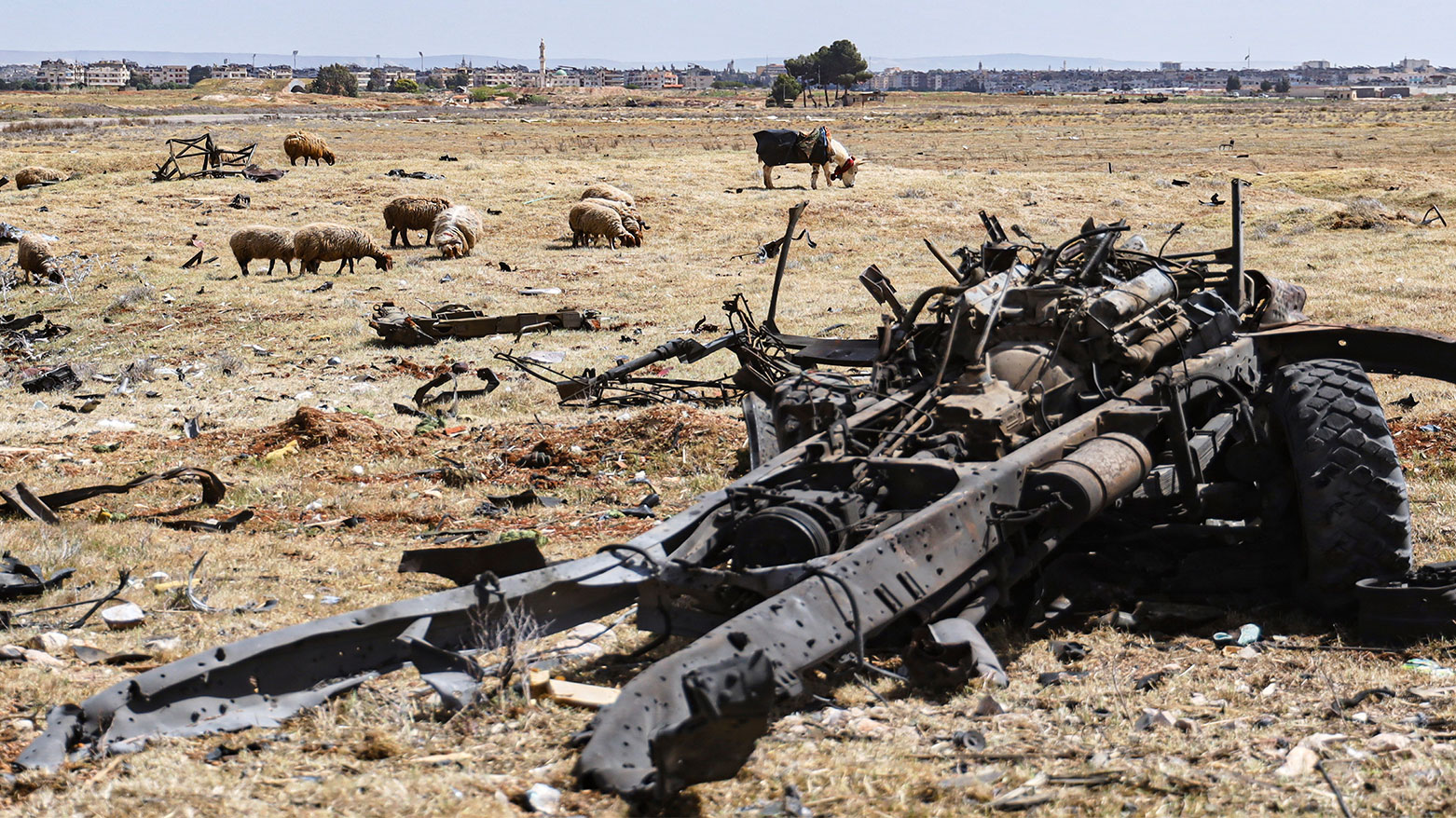 A damaged vehicle sits amid the debris left by an Israeli strike on a military airbase near Hama, Syria, April 3, 2025. (Photo: AP)