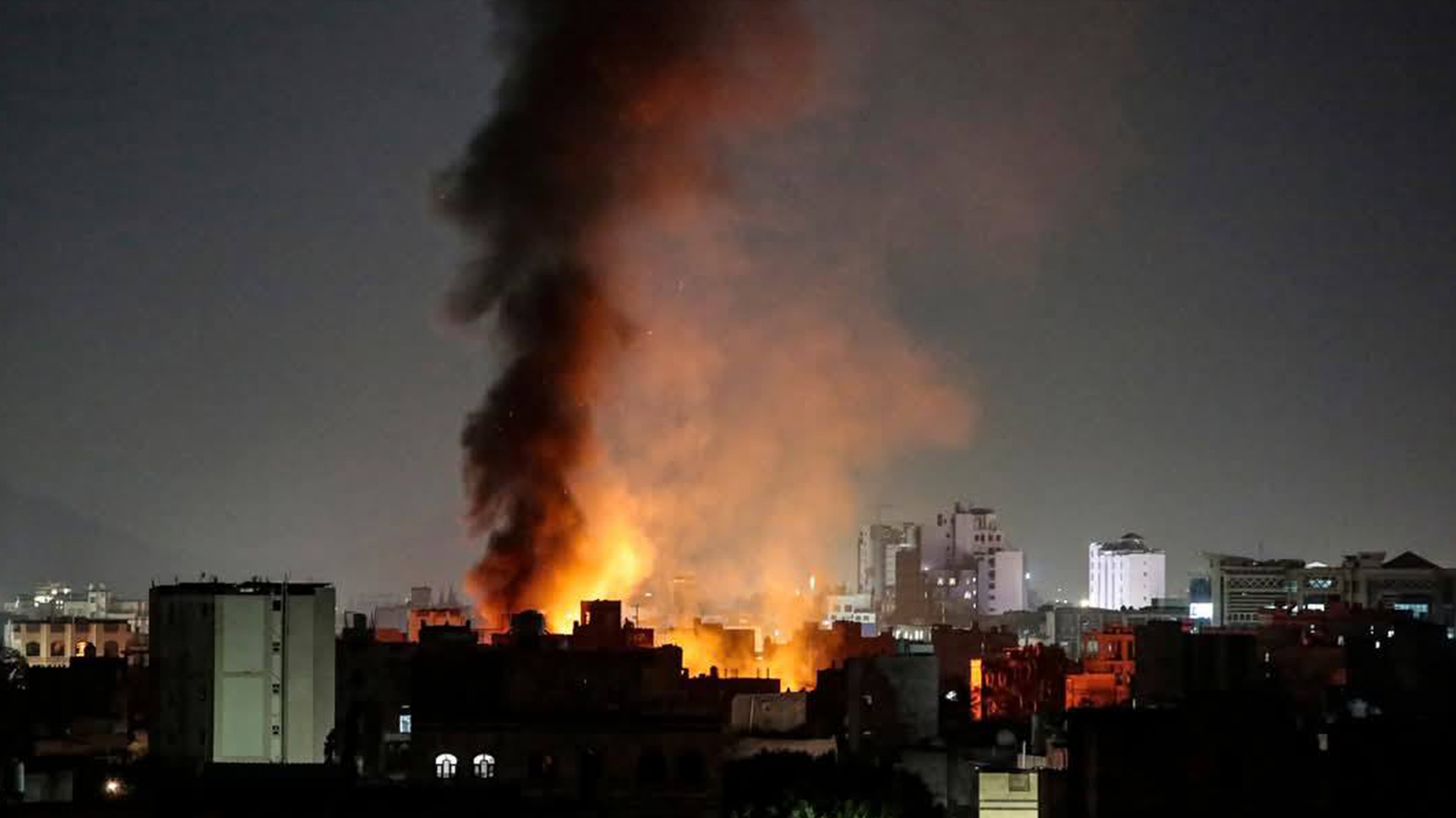 Smoke plumes rise above buildings following US strikes on Yemen's Huthi-controlled capital Sanaa on Mar. 19, 2025. (Photo: AFP)