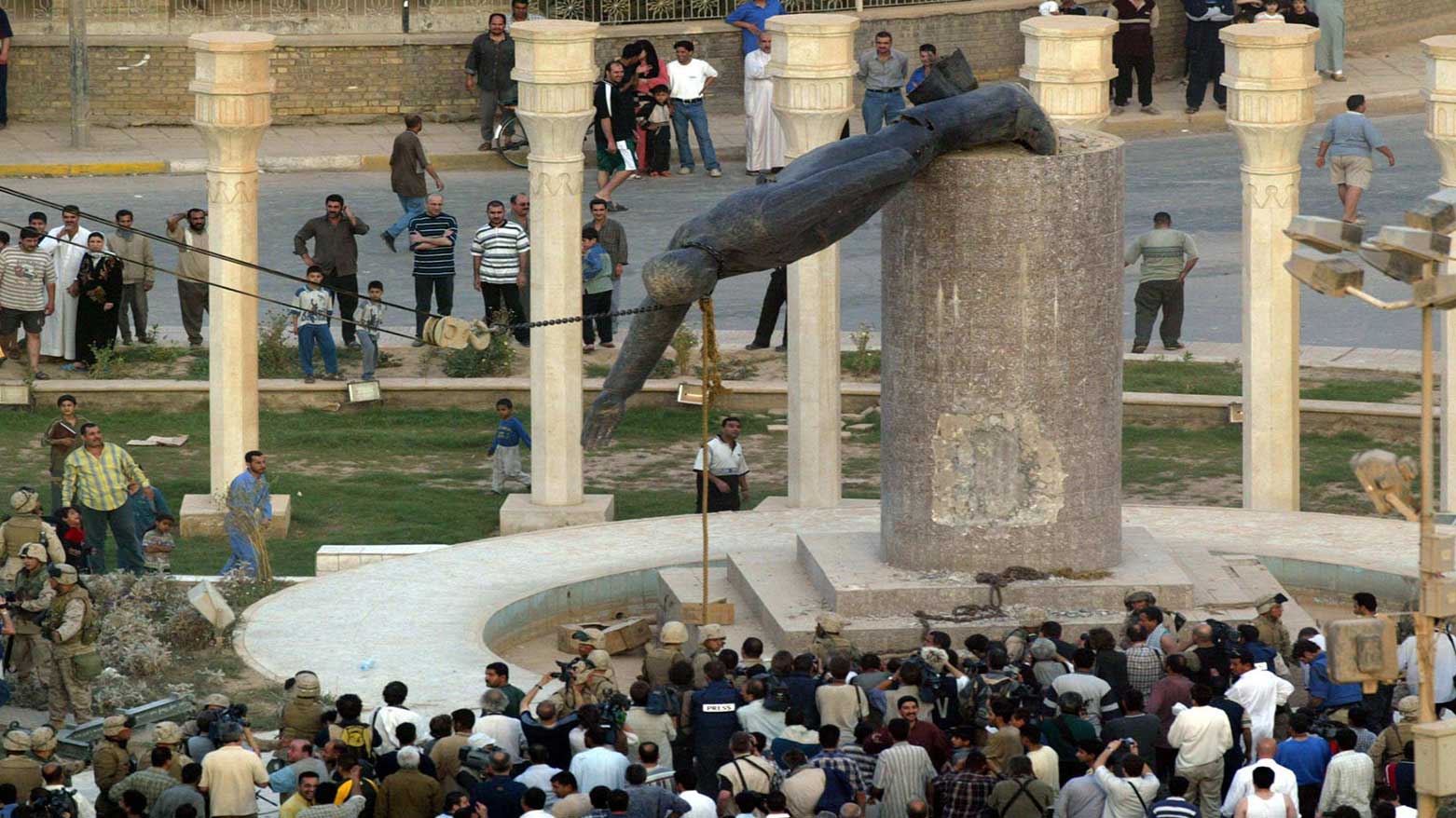 Iraqis and American soldiers together tear down Saddam Hussein’s statue in Baghdad on April 9, 2003, celebrating the victory over tyranny and the fall of Saddam's brutal regime. (Photo: KRG)