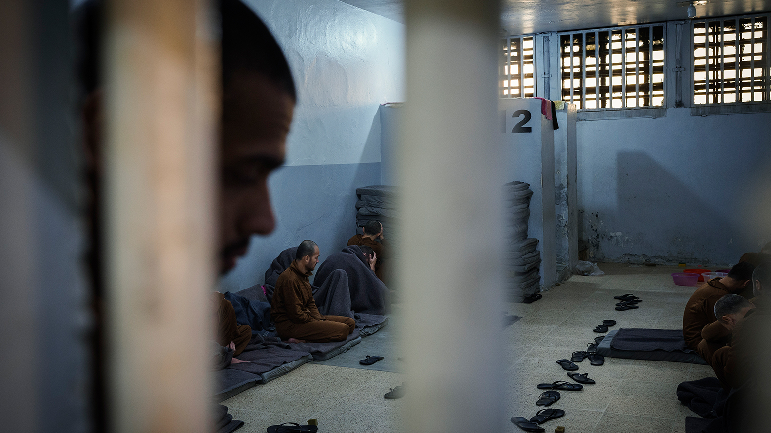 Inmates accused of being an Islamic State (ISIS) fighters sit inside a cell at the Syrian Democratic Forces-run Gweiran Prison, now called Panorama, in Hassakeh, northeastern Syria, Friday, Jan. 31, 2025. (Photo: AP)