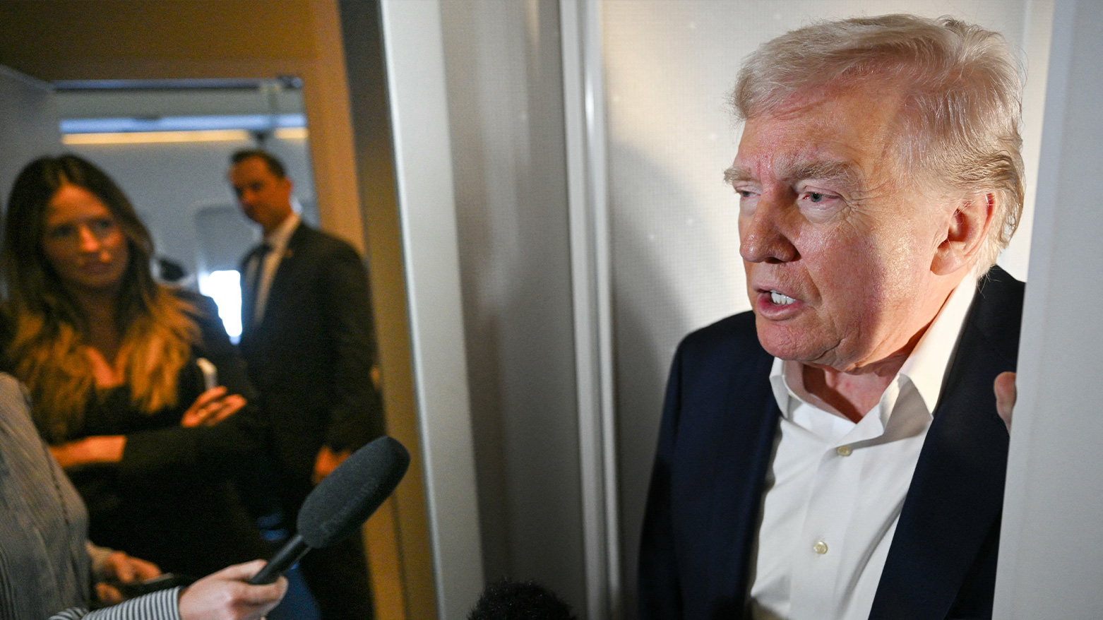 The U.S. President Donald Trump speaking to journalists aboard Air Force One. (Photo: AFP)