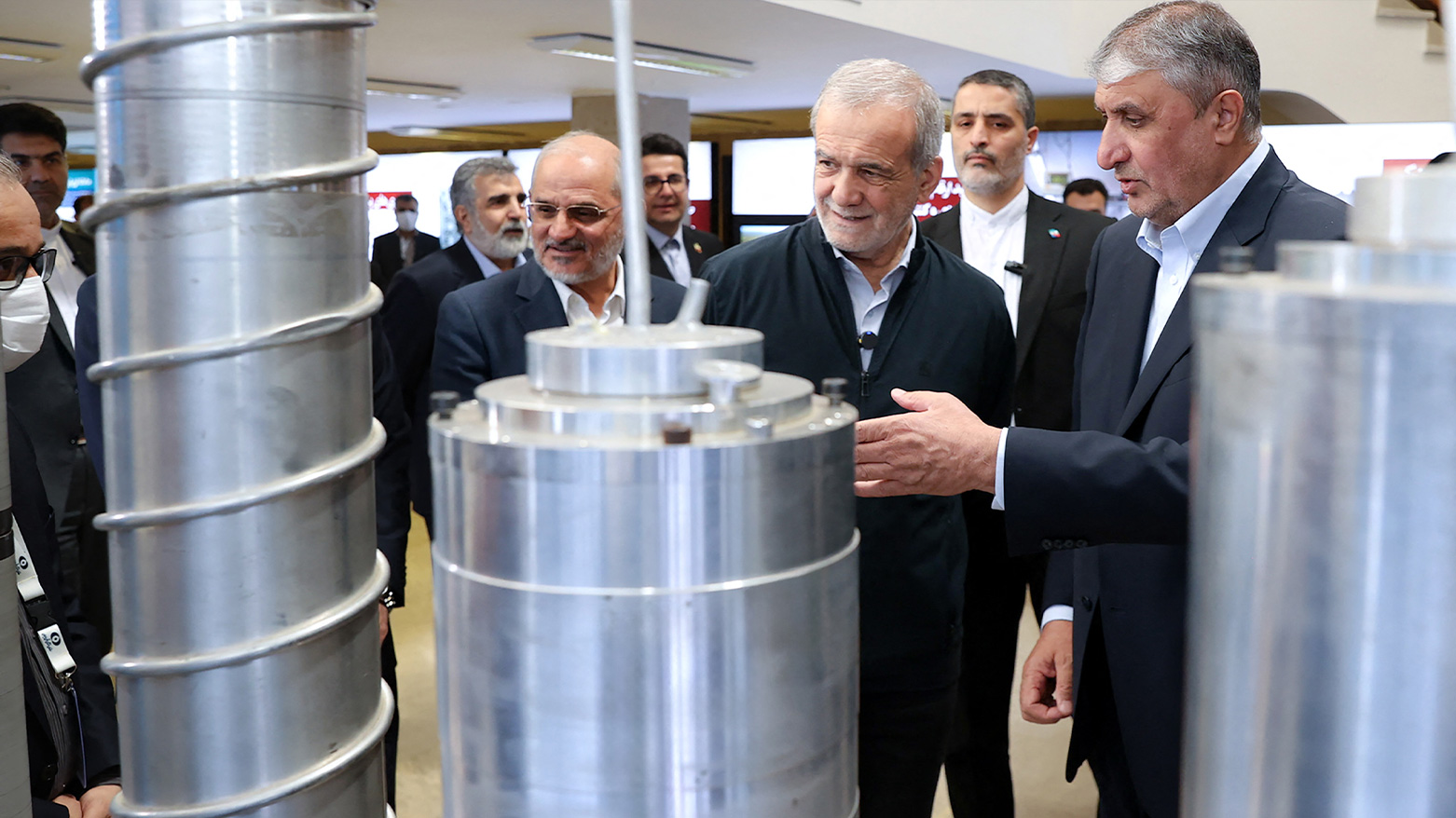 Iran's President Pezeshkian (2nd R) and the Atomic Energy Organisation of Iran (AEOI) chief Mohammad Eslami (R). (Photo: AFP)
