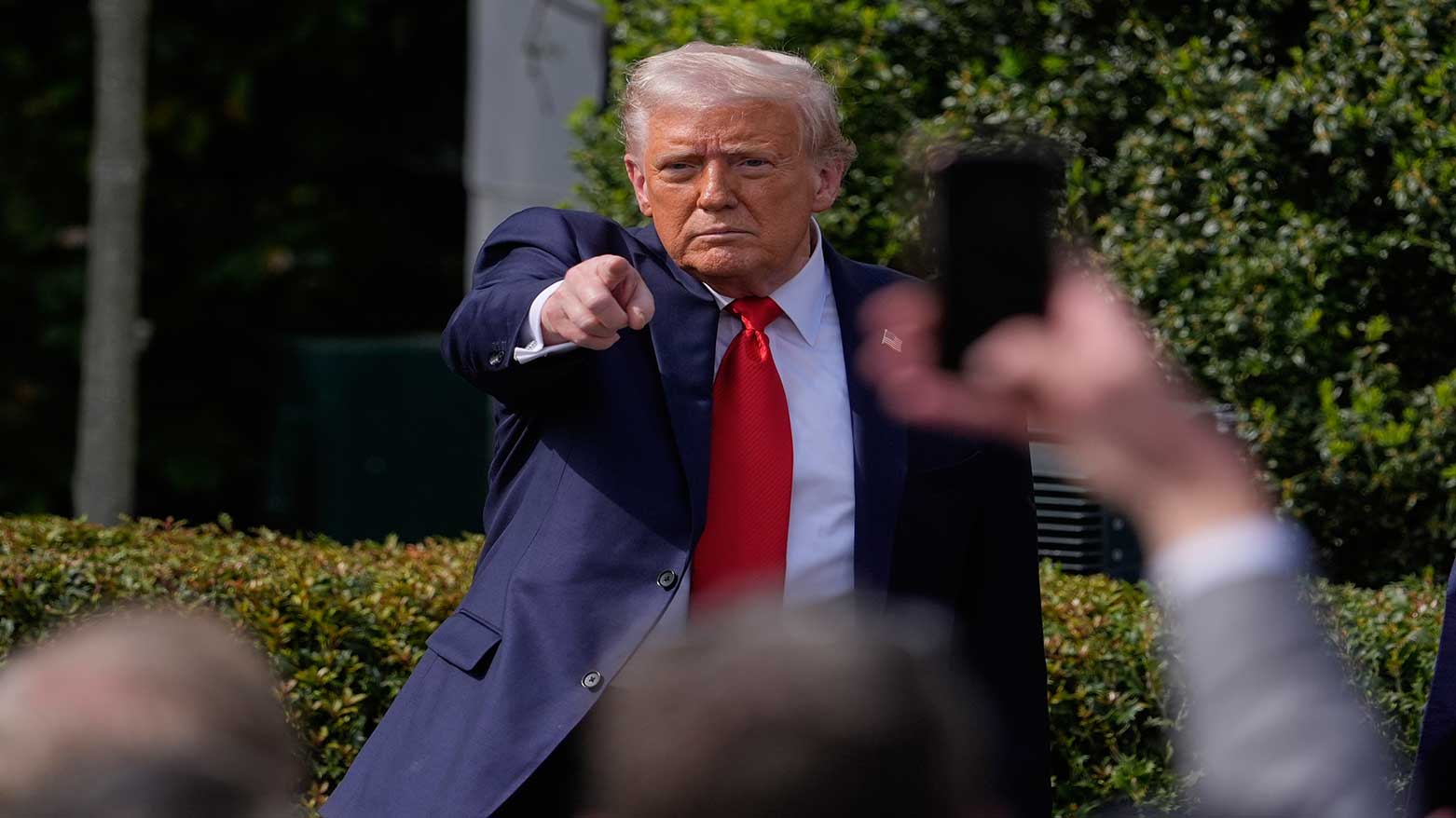 President Donald Trump gestures to the crowd as he departs the 2025 College Football National Champions, White House, April 14, 2025. (Photo: AP)