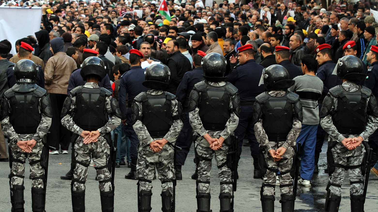 Nov. 28, 2014, file photo, members of the Jordanian security surround a demonstration of the Muslim Brotherhood in downtown Amman. (Photo: AP)
