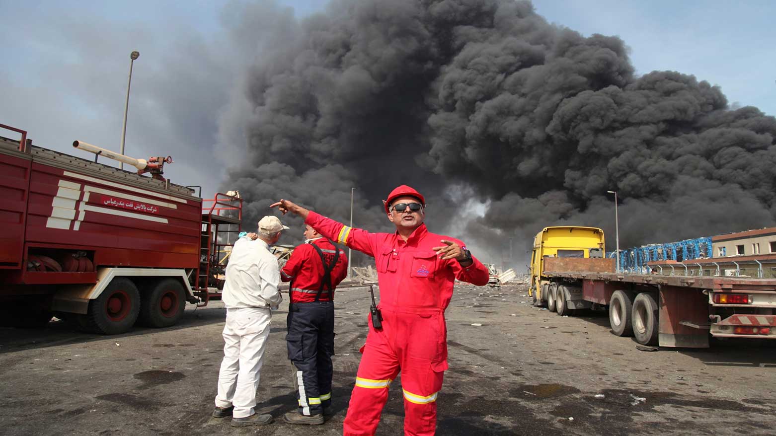 Firefighters work as black smoke rises in the sky after a massive explosion rocked a port near the southern city of Bandar Abbas, Iran, April 26, 2025. (Photo: AP)