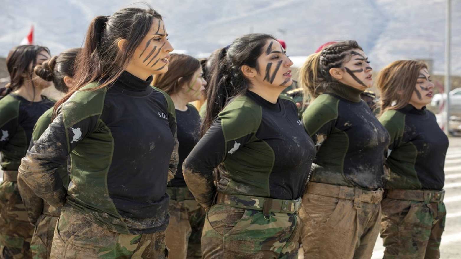 Female Peshmerga members rest after crawling through mud during their graduation ceremony held at Bapshytan Training Center in the Kurdistan Region, Feb. 12, 2020. (Photo: U.S. Army)
