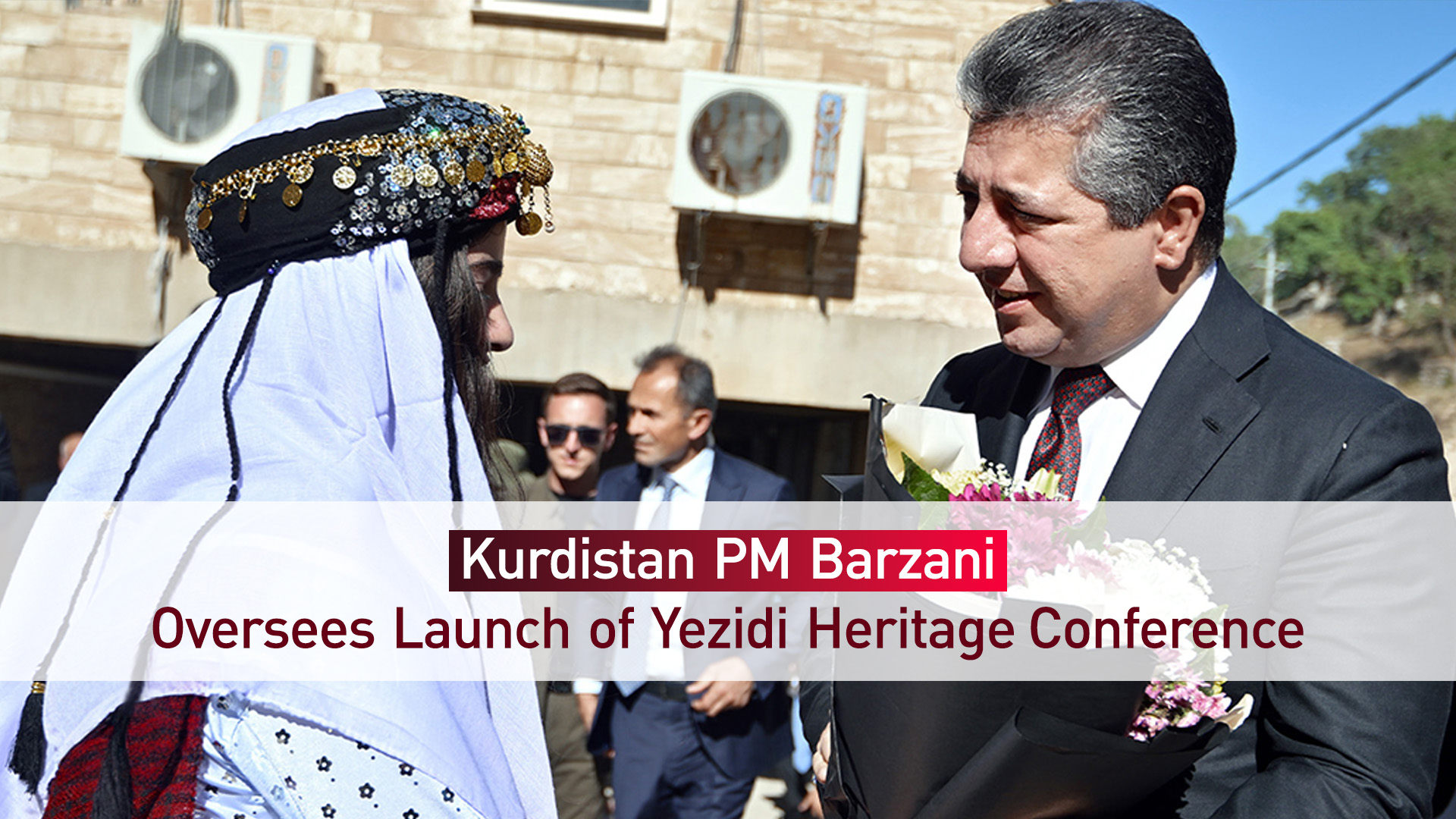 Kurdistan PM Barzani, received with flowers by a Yezidi girl, at Lalish Temple. (Photo: Kurdistan24)