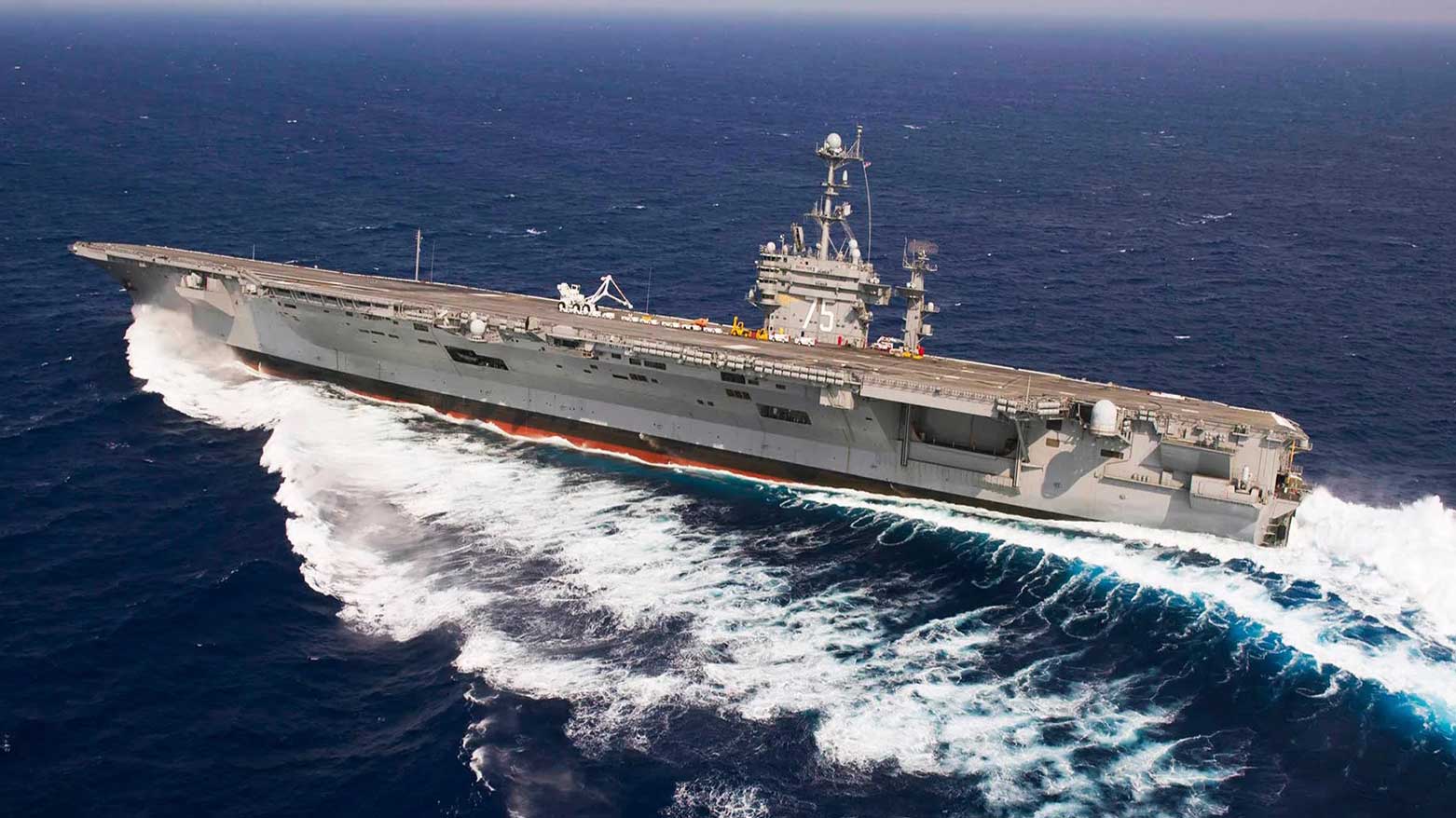USS Harry S. Truman, making a hard turn during post maintenance sea trials. (Photo: USN/MC3)