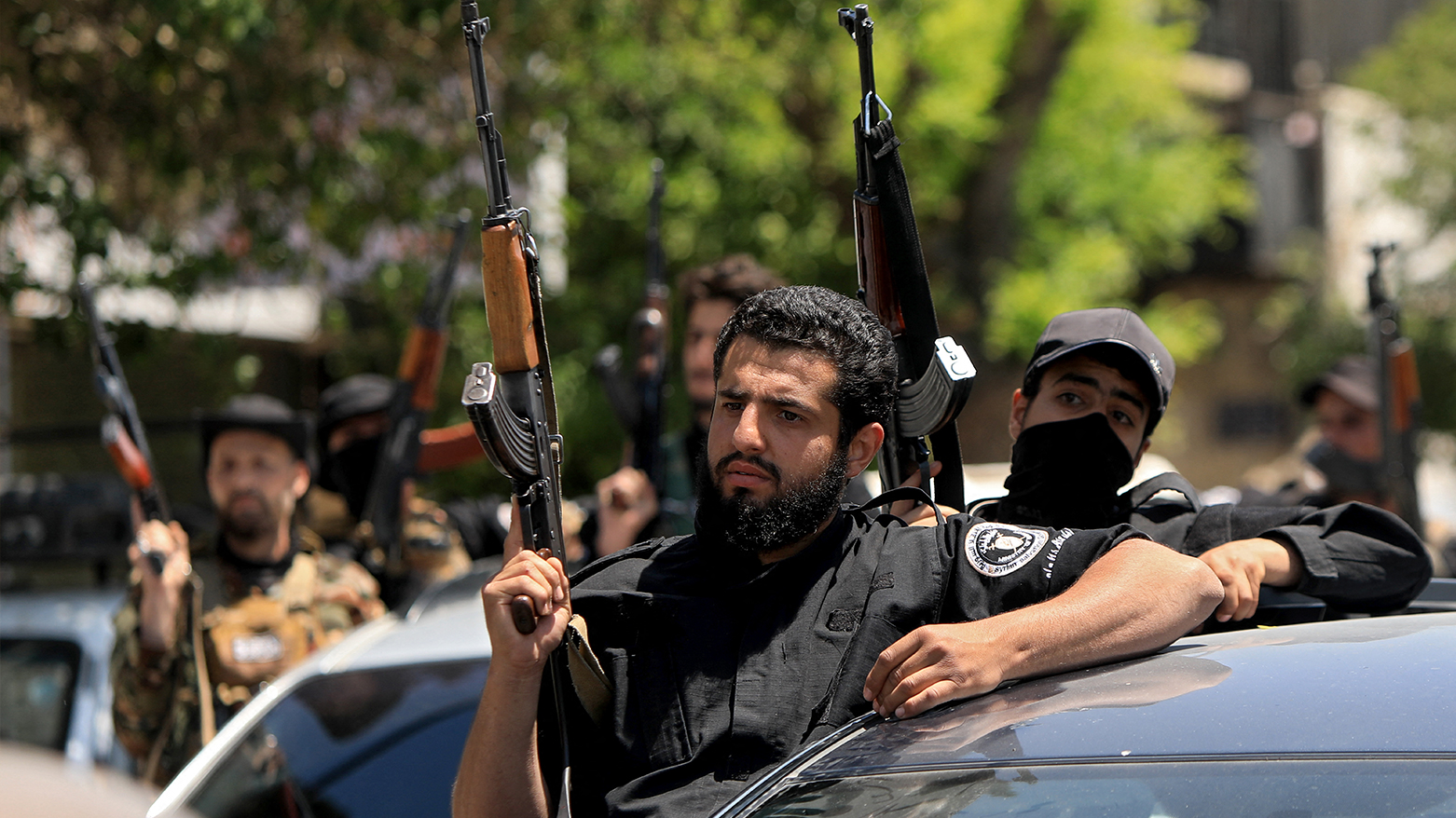 Members of Syria's security forces stand guard next to their vehicles in the capital Damascus on Apr. 29, 2025, following overnight sectarian clashes. (Photo: AFP)