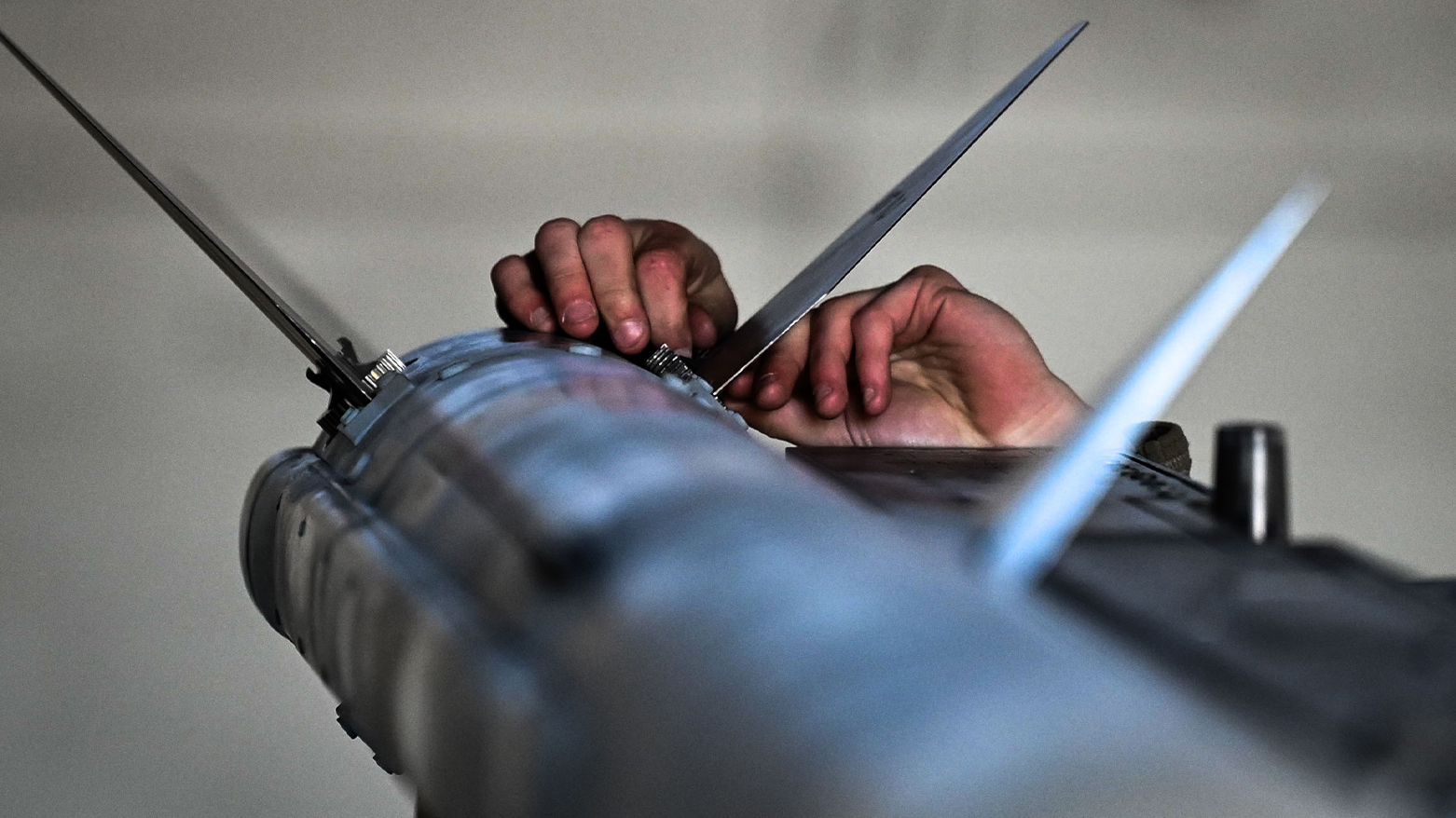 U.S. Airman installs fins on an AIM-120 AMRAAM during a load crew competition at Shaw Air Force Base, Jan. 17, 2025. (Photo: DVIDS)