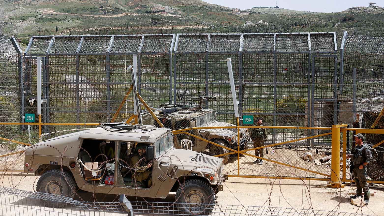 Israeli soldiers guard as Druze men rally for Syrian Druze near the border in Majdal Shams, Golan Heights, April 30, 2025. (Photo: AFP)
