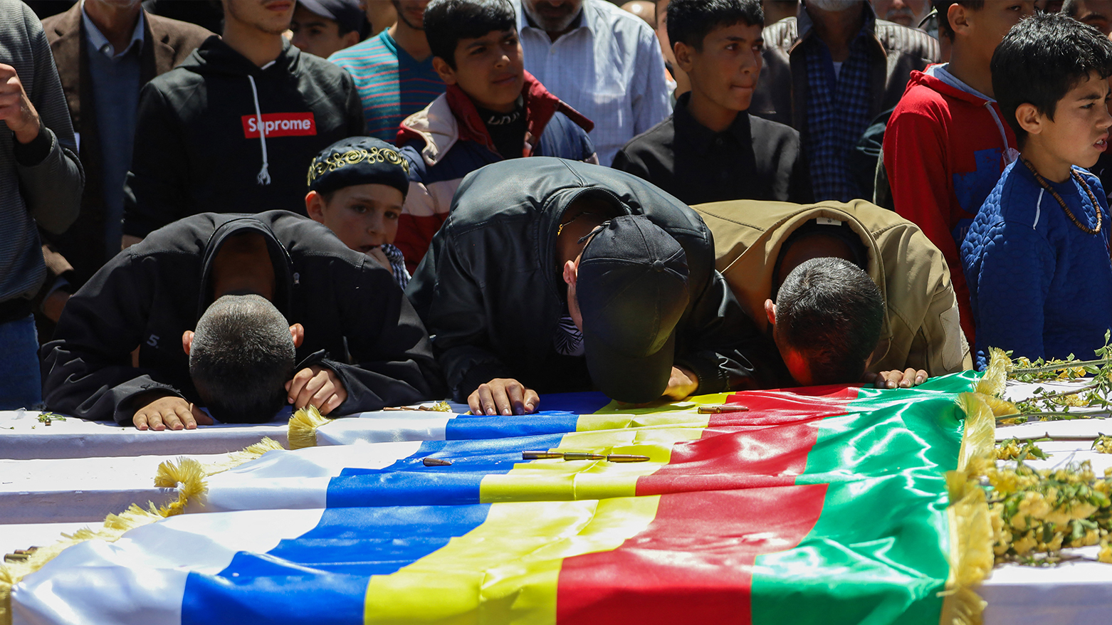 People mourn by coffins of members of the Syrian minority who were killed in recent sectarian clashes during their funeral in Salkhad village in Syria's southern Suwayda governorate on May 3, 2025. (Photo: AFP)
