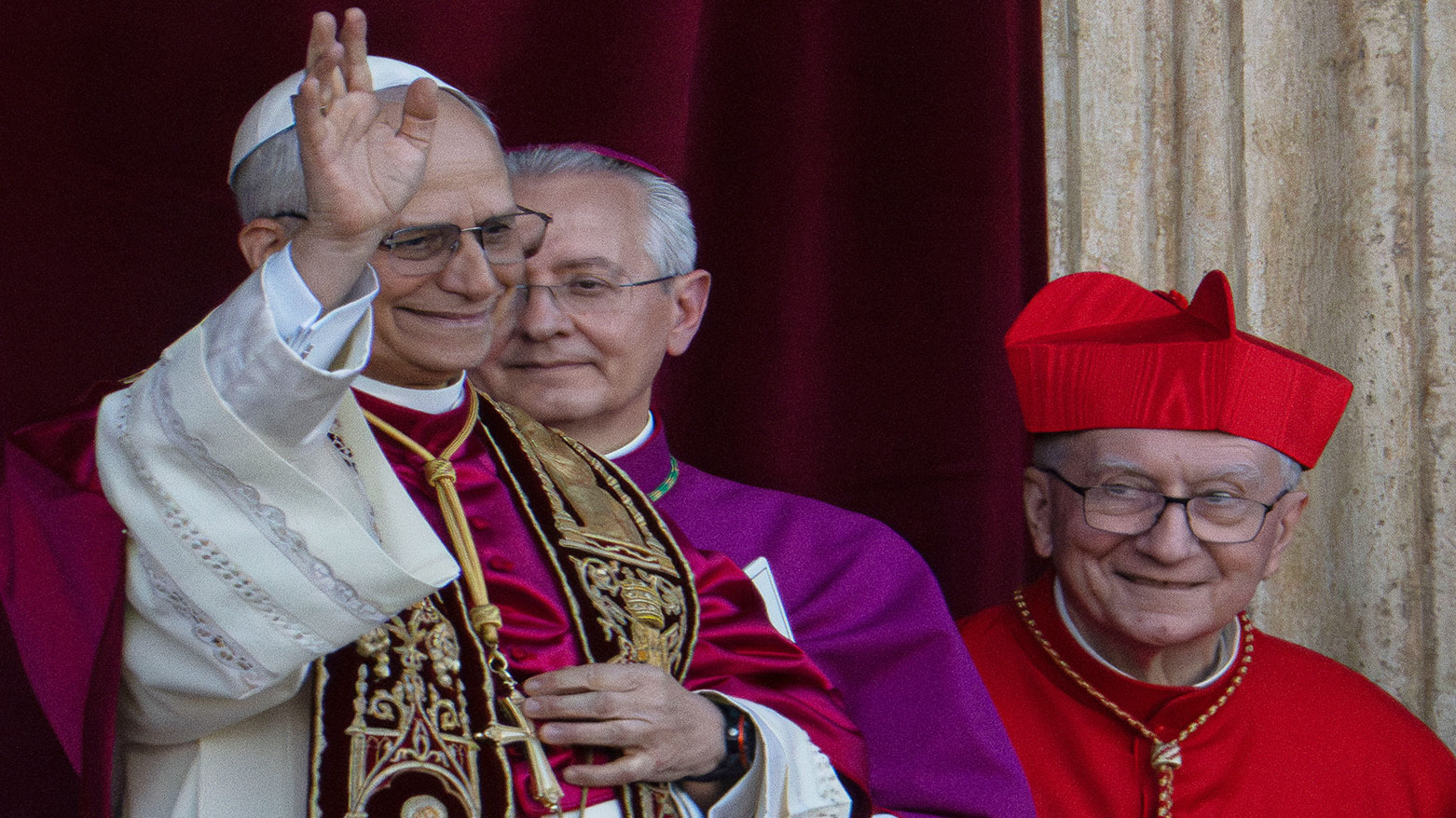 Newly elected Pope Leo XIV, left, appears on the central loggia of St. Peter's Basilica at the Vatican shortly after his election as the 267th pontiff of the Roman Catholic Church, May 8, 2025. (AP Photo/Domenico Stinellis)