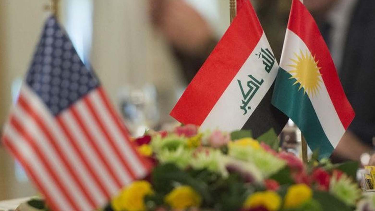 The flags of Kurdistan, Iraq and the United States of America. (Photo: Kurdistan24)