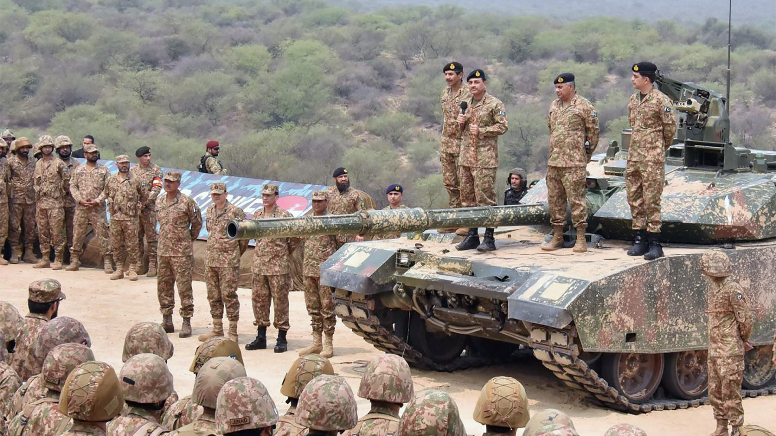 Pakistan's Army Chief General Syed Asim Munir (Top 3R) stands on military tank speaks with army troops, May 1, 2025. (Photo: AFP)