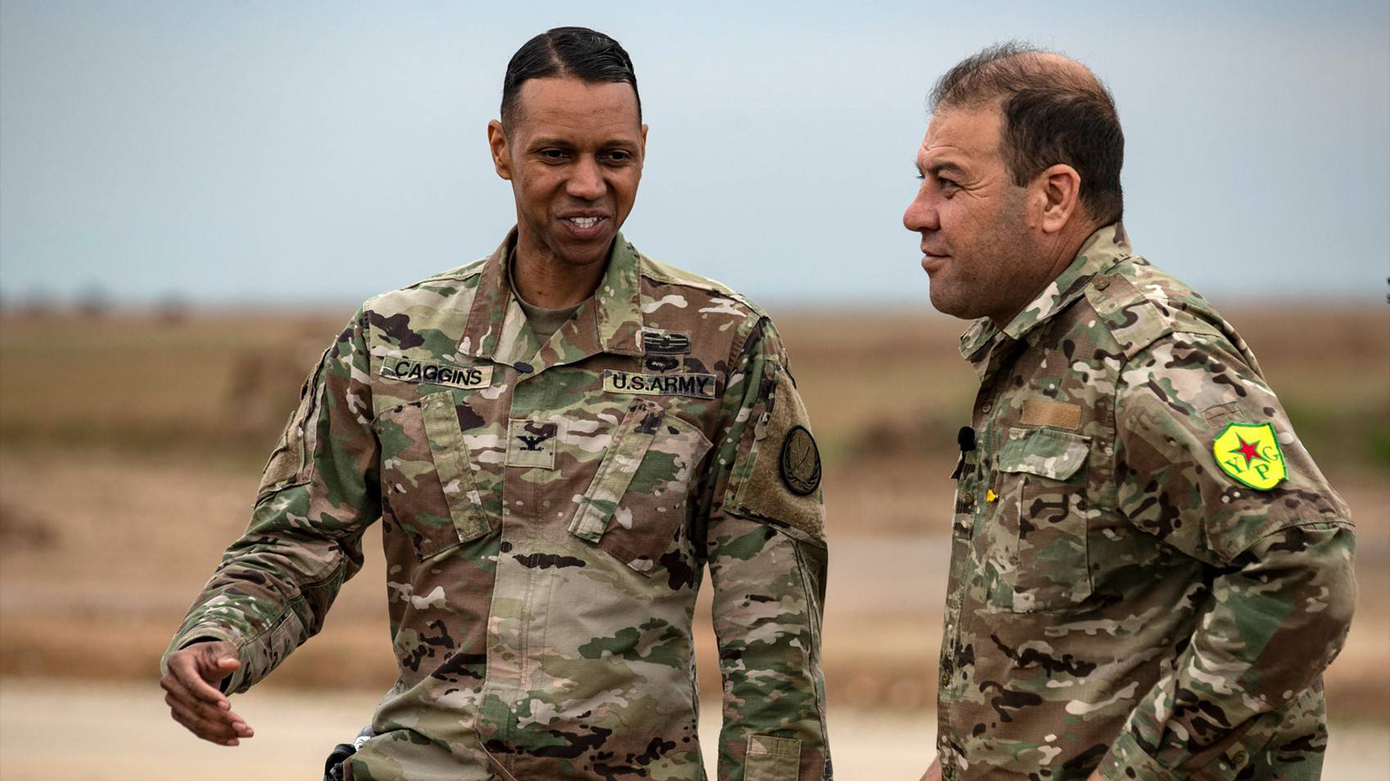 US Army Colonel Myles Caggins (L), spokesperson for the anti-IS coalition, and SDF spokesman Mustafa Bali (R) visit a base in Rumaylan, Western Kurdistan, on Mar. 6, 2020. (Photo: AFP)