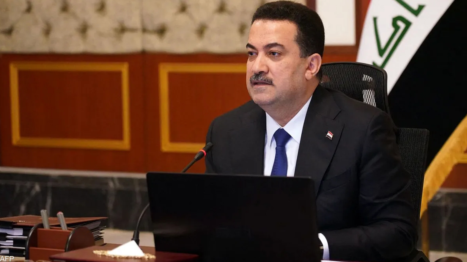 A handout picture released by Iraq's Prime Minister's Media Office shows Iraq's Prime Minister Mohammed Shia al-Sudani heading a ministers meeting to vote on the federal budget in Baghdad on Mar. 13, 2023.