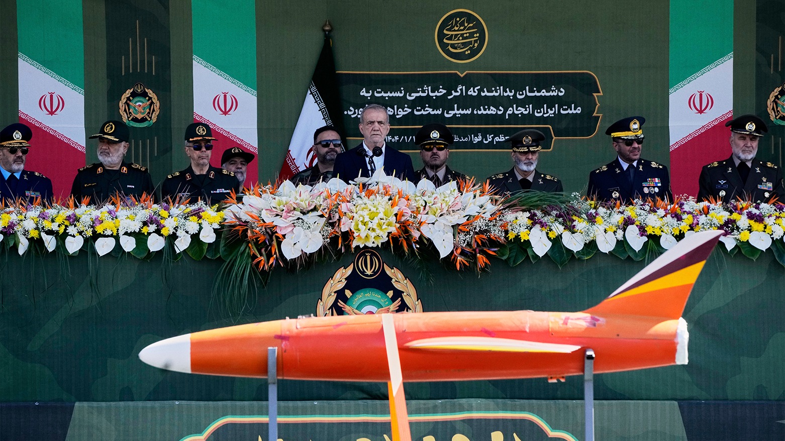 Iran’s President Pezeshkian (C) reviews troops at Army Day parade near Tehran, April 18, 2025. (Photo: AP)