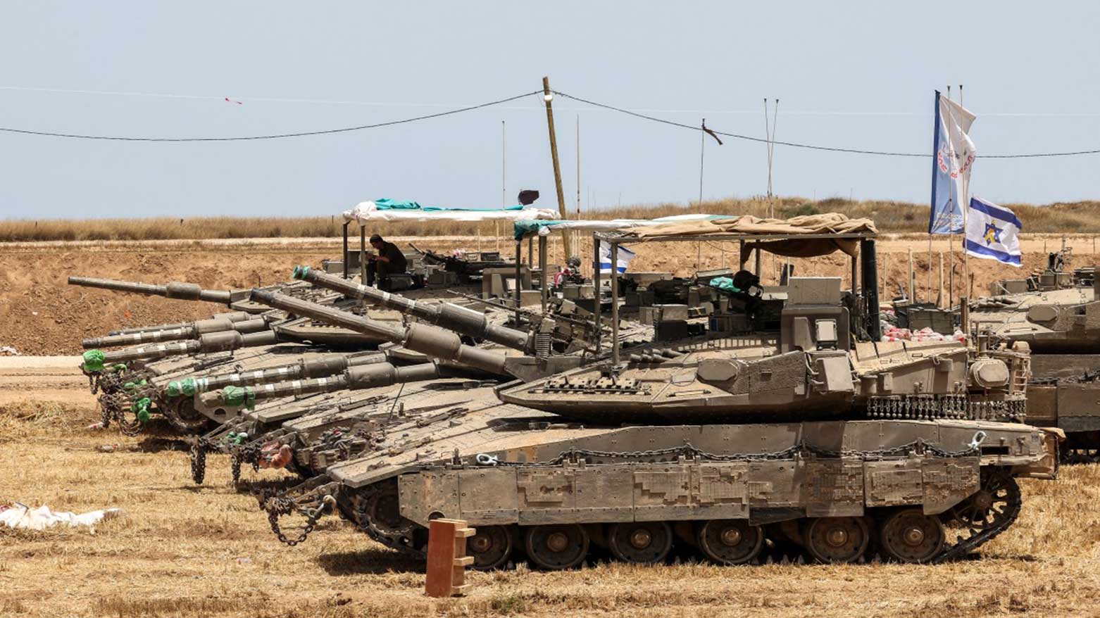 Photo taken from a position in southern Israel shows Israeli tanks deployed on the border with the Gaza Strip on May 17, 2025. (Photo: AFP)