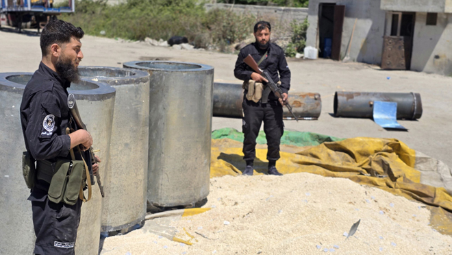 Syrian security personnel pictured with the seized Captagon pills during a recent anti-narcotics operation. (Photo: Syrian Media)