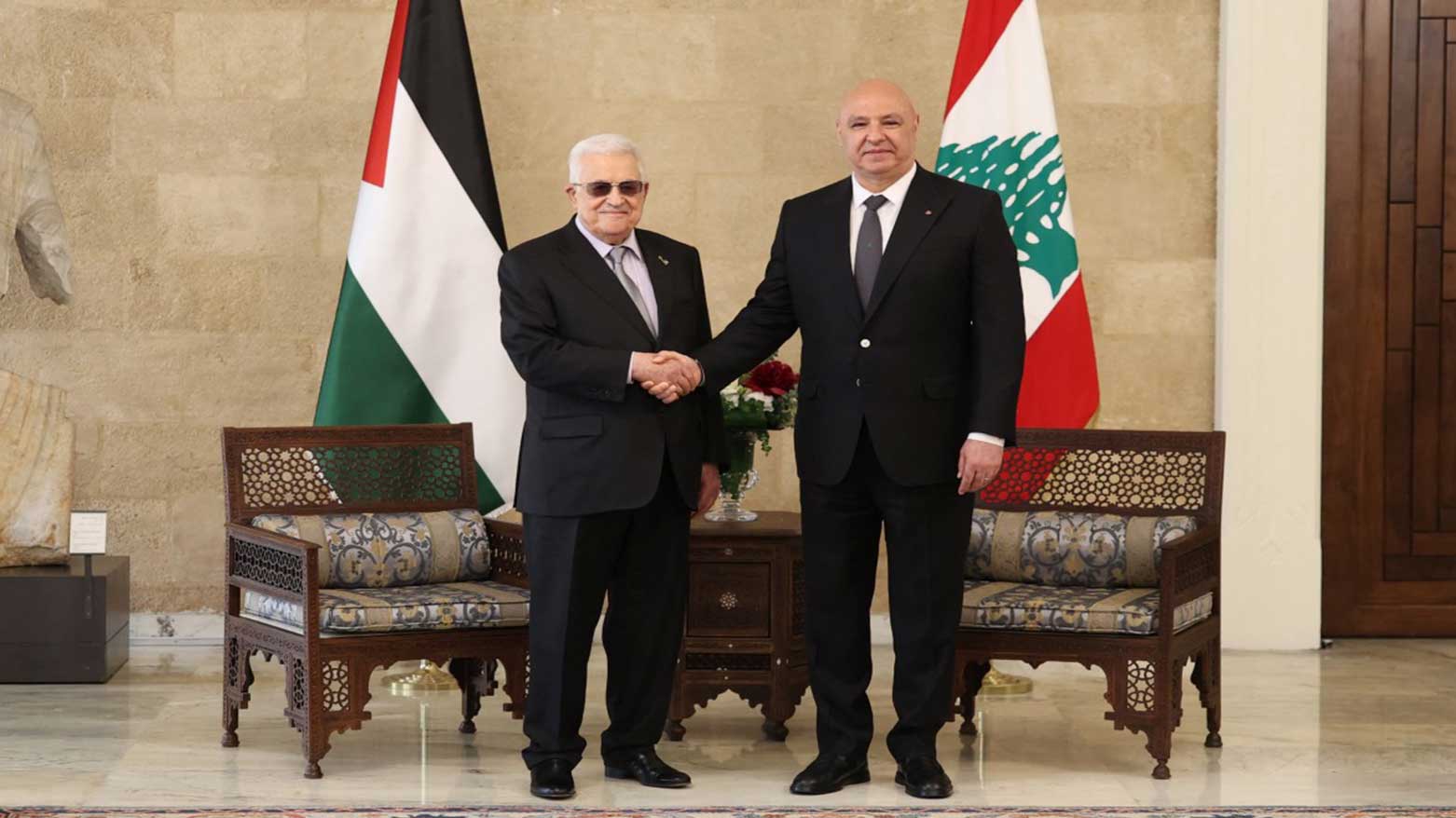 Lebanon's President Joseph Aoun (R) welcoming his Palestinian counterpart Mahmud Abbas at the Baabda presidential palace, east of the capital Beirut, on May 21, 2025.