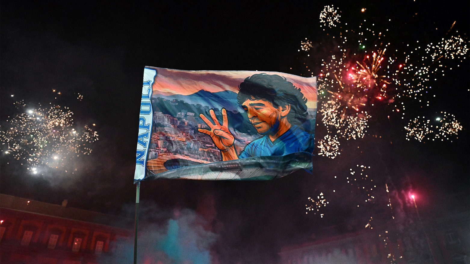 Napoli fans celebrate title win under Maradona’s flag in Naples. (Photo: AFP)