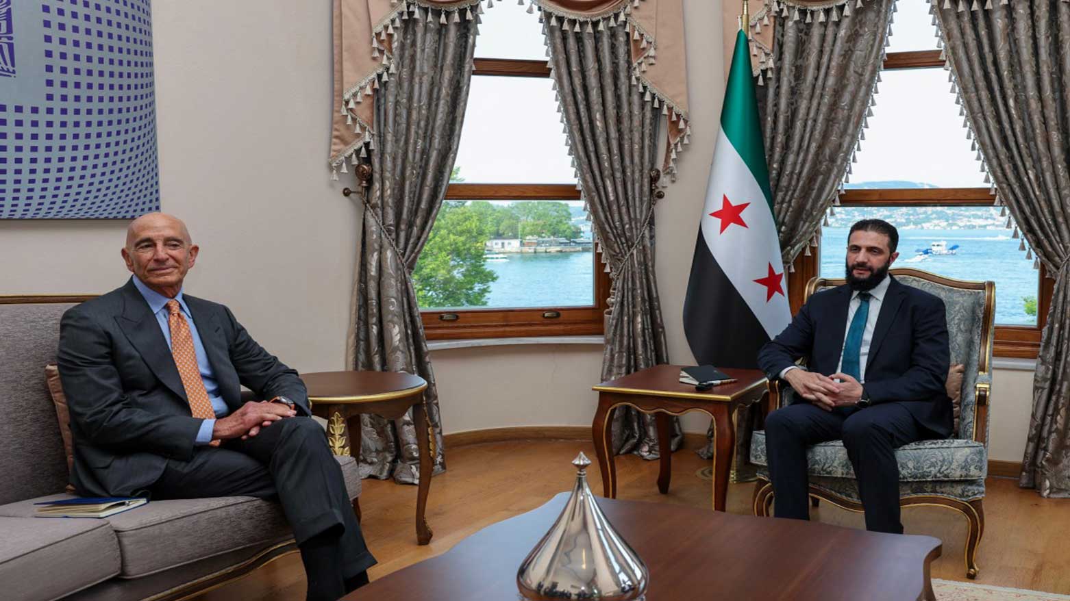 US Ambassador to Turkey Thomas Barrack (L) during a meeting with Syria's interim President Ahmed al-Sharaa in Istanbul, May 24, 2025. (Photo: AFP)