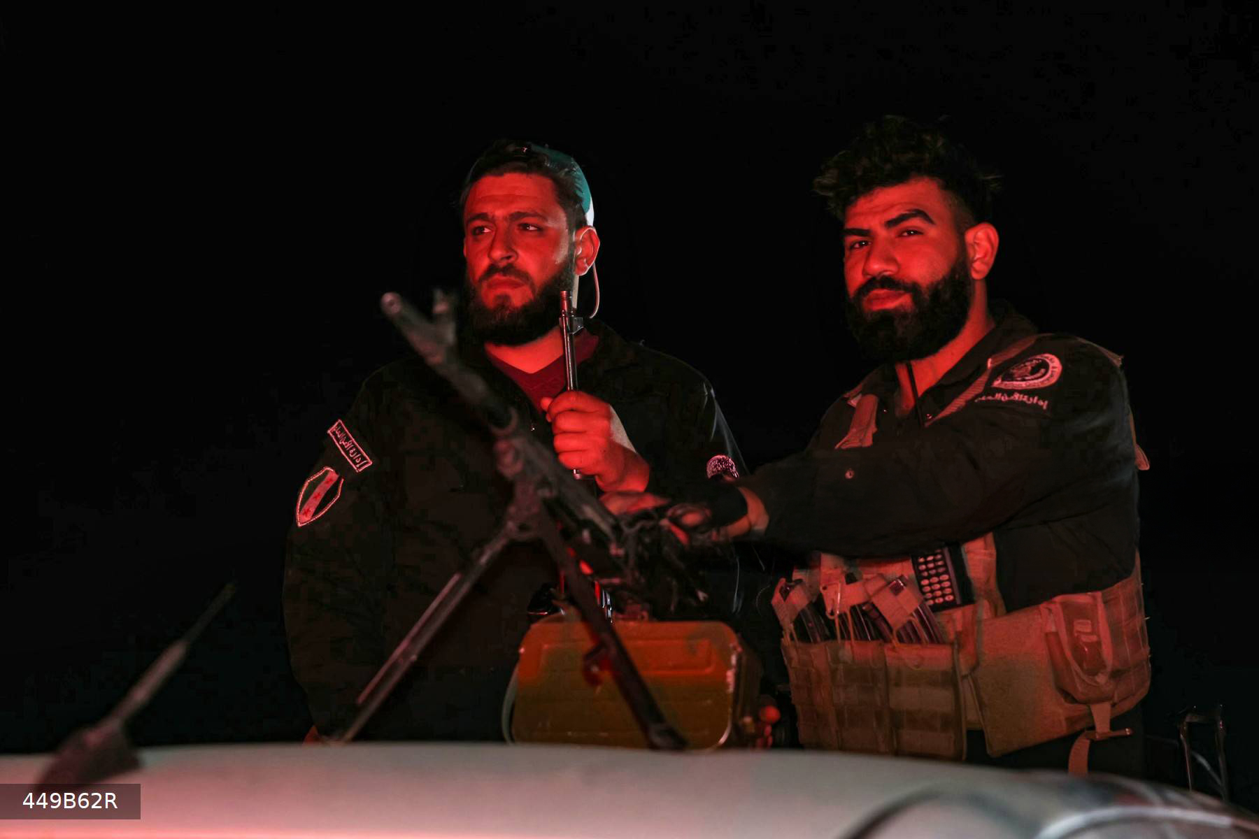 Members of Syria's security forces stand guard at a checkpoint at the entrance of Jaramana near Damascus early on May 2, 2025. (Photo: AFP)