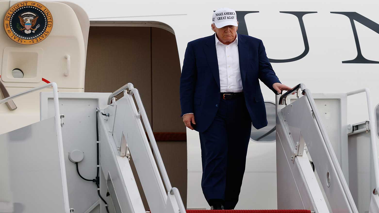 President Donald Trump walks down the stairs of Air Force One upon his arrival at Joint Base Andrews, Md., May 25, 2025.