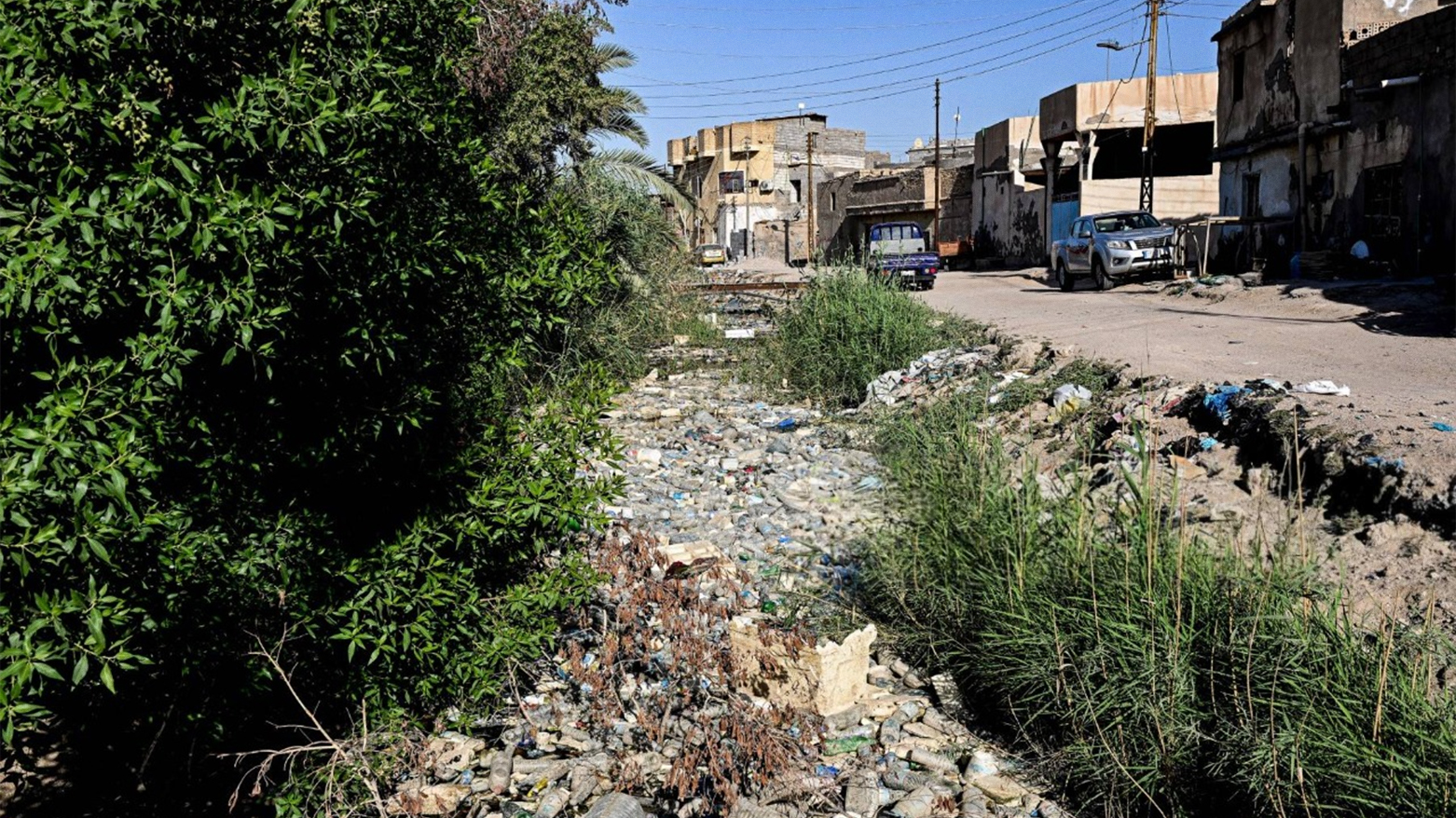Plastic waste clogs a tributary canal off the Shatt al-Arab in Basra, southern Iraq, June 4, 2024. (Photo: AFP)