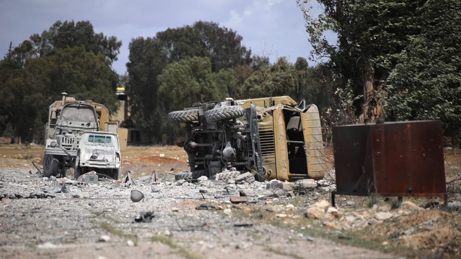 Debris and military vehicles lie at the scene of an Israeli strike in Syria's southern Hama governorate, on Apr. 3, 2025. (Photo: AFP)