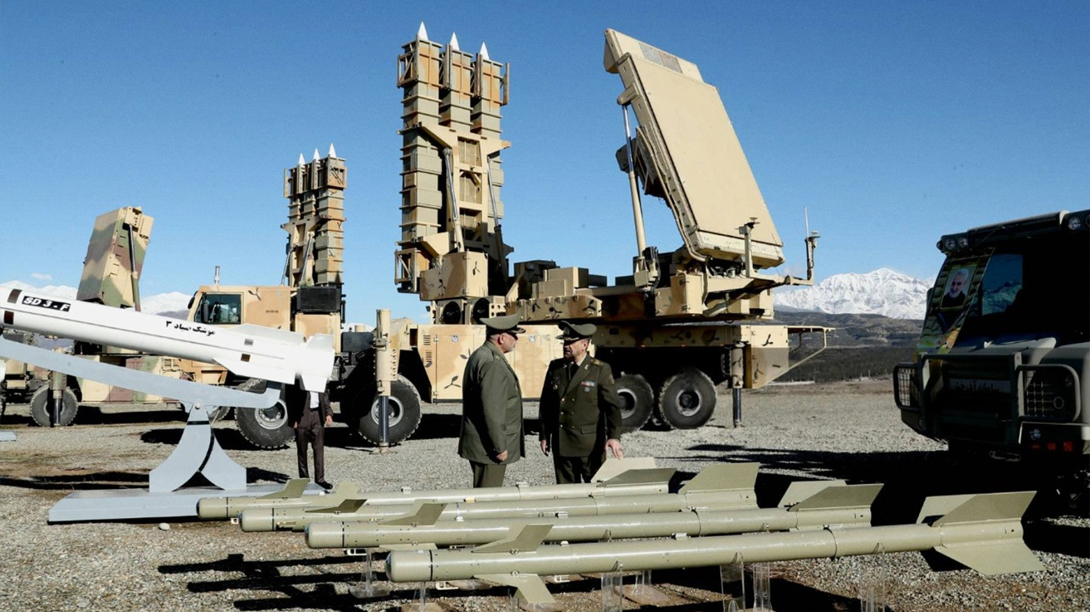 Iranian officers with a Sayad-3 missile at the Arman defense systems unveiling. (Photo: AFP)