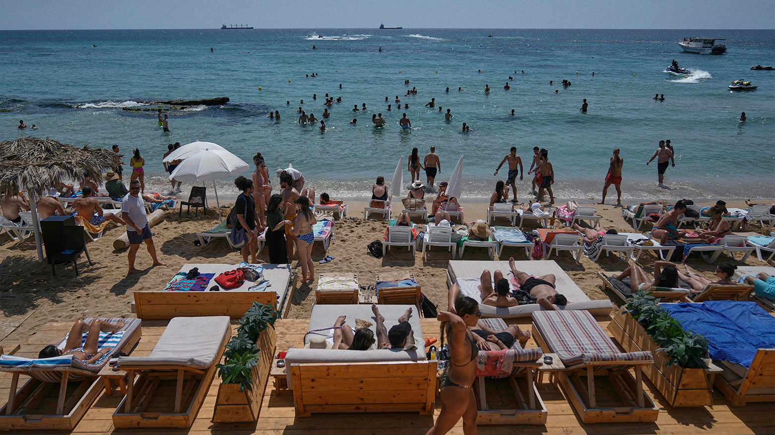 People sunbathe on the beach along the Mediterranean Sea in Batroun, northern Lebanon, May 31, 2025. (Photo: AP)