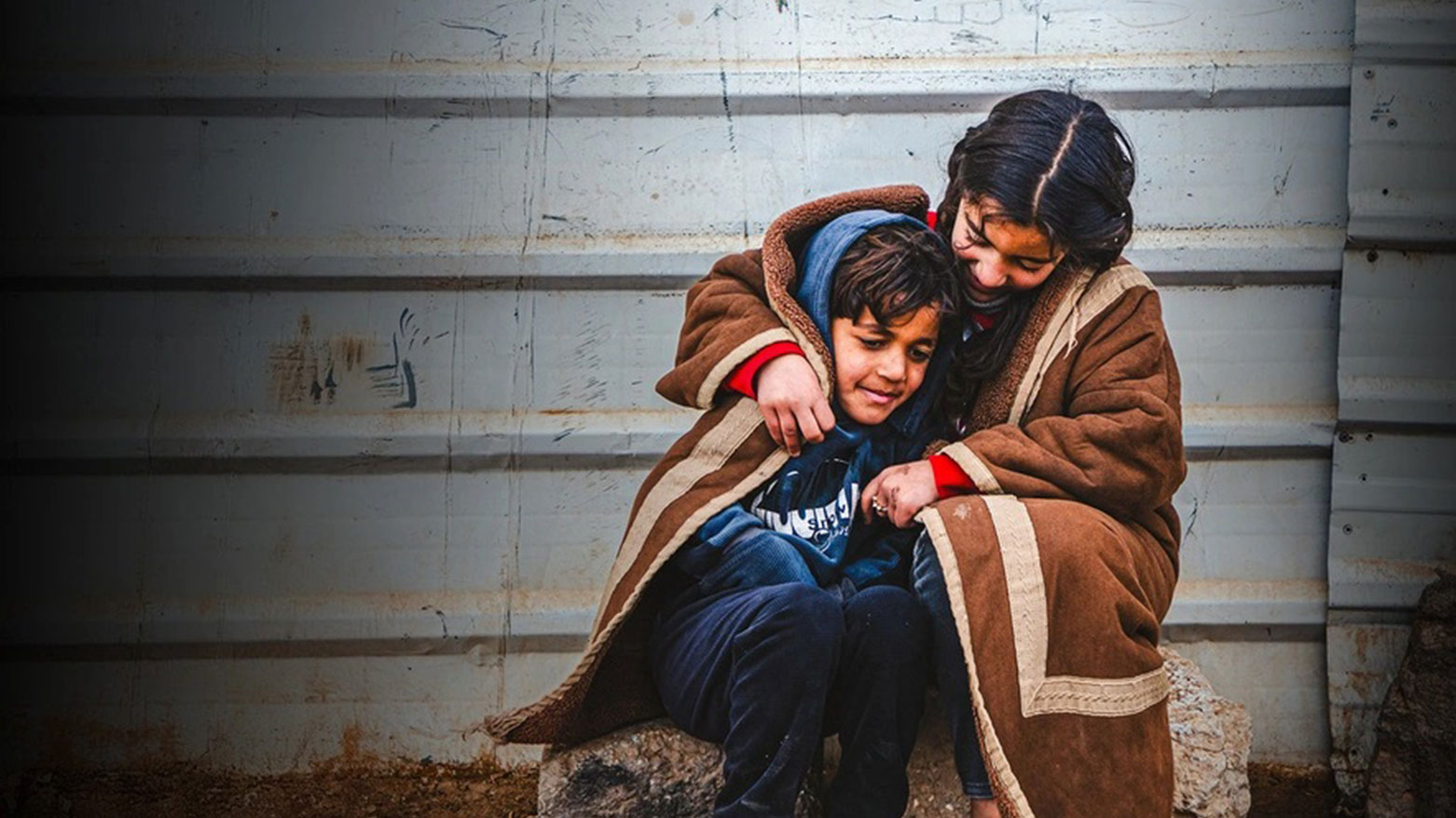 Syrian refugees Batool, 9, and her brother Abdulaziz, 7, in the Zaatari refugee camp, Jordan. (Photo: UNHCR)